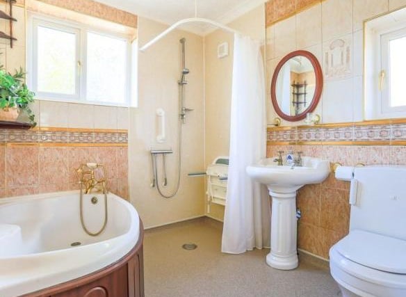 The bathroom has a corner bath, separate shower cubicle, W.C and sink.