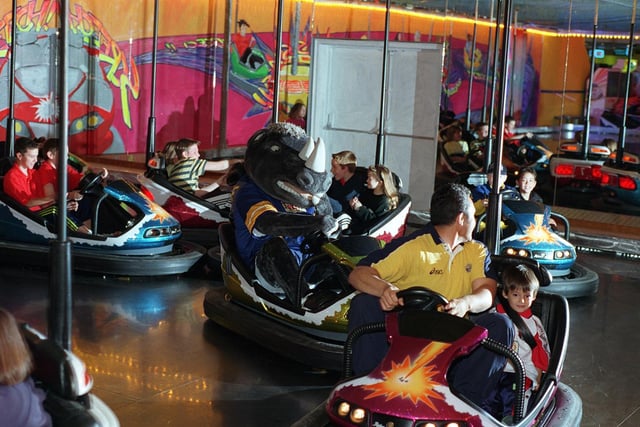 Ronnie the Rhino drives one of the new dodgems cars at the official relaunch of the LA Bowl on Sweet Street.