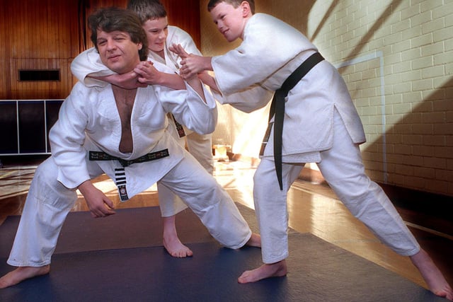 Twins Richard Trenam and Thomas Trenam (right) from Cardinal Heenan Roman Catholic High School were awarded Junior Black Belt status - the highest level possible for a junior. They are pictured in training with their instructor Gary Donoughue of the Yorkshire Judo Association.
