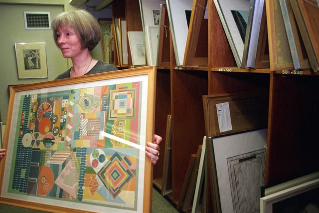 Leeds Art Gallery was offering to loan art to the public. Pictured is Corrine Miller with one of the pictures available.