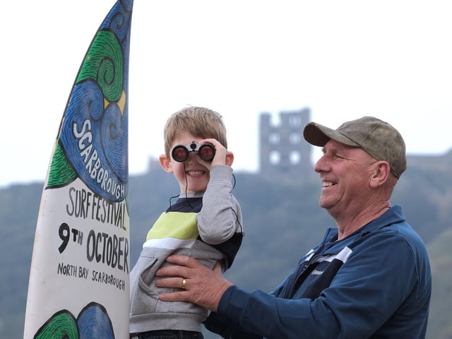 Watching the surfing action with Grandad.