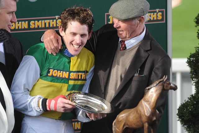 Trevor Hemmings celebrates alongside jockey Jason Maguire after winning the Grand National in 2011 with Ballabriggs.