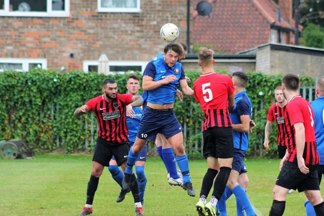 Tommy Wilson wins a header

Photo by Alec Coulson