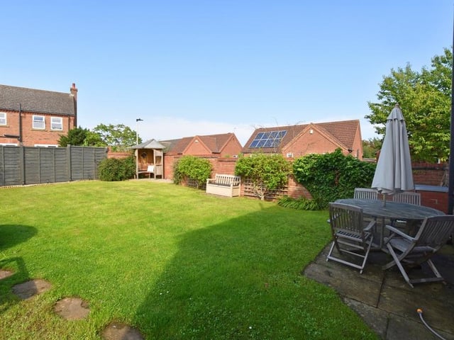 The enclosed lawned garden to the rear of the property.