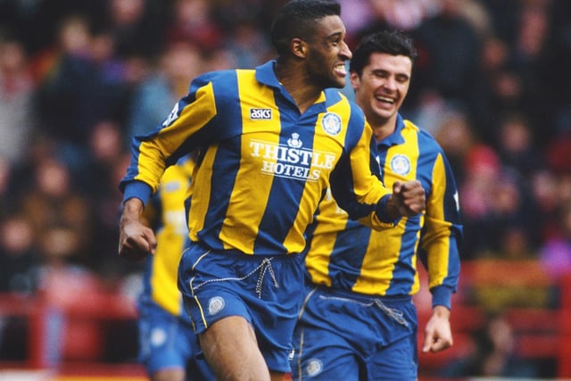 Brian Deane celebrates scoring during a Premiership clash against Sheffield United at Bramall Lane in March 1994.