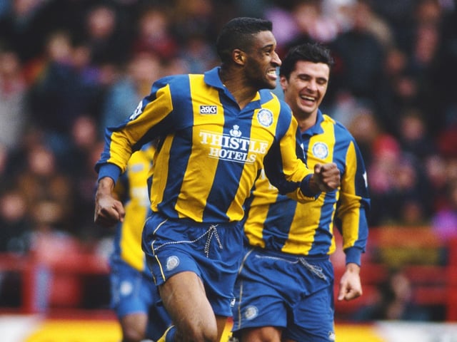 Brian Deane celebrates scoring during a Premiership clash against Sheffield United at Bramall Lane in March 1994.