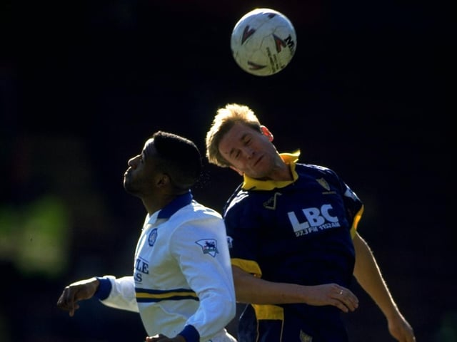 Brian Deane rises high with Wimbledon's John Scales during the Premiership clash at Selhurst Park in March 1994. The Whites lost 1-0.