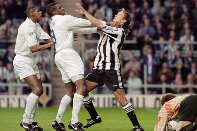 Brian Deane gets to grips with Newcastle United defender Darren Peacock as Carlton Palmer looks on during the Premier League clash at St James' Park in November 1995.