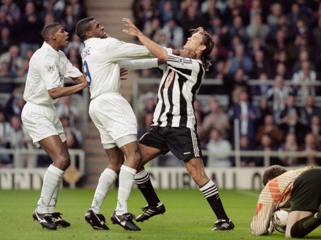 Brian Deane gets to grips with Newcastle United defender Darren Peacock as Carlton Palmer looks on during the Premier League clash at St James' Park in November 1995.