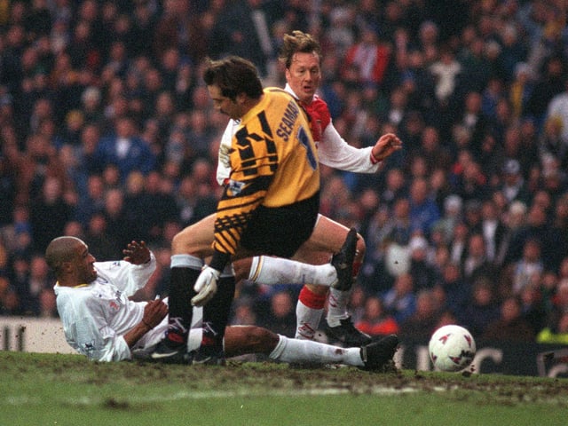 Brian Deane slides the ball past Arsenal's David Seaman watched by Lee Dixon only for the goal to be disallowed during the Premiership clash at Elland Road in February 1997. The game finished 0-0.