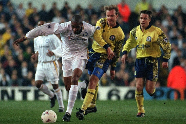 Brian Deane breaks free from Blackburn Rovers defenders Henning Berg (left) and Greame Le Saux during the Premiership clash at Elland Road in April 1997.