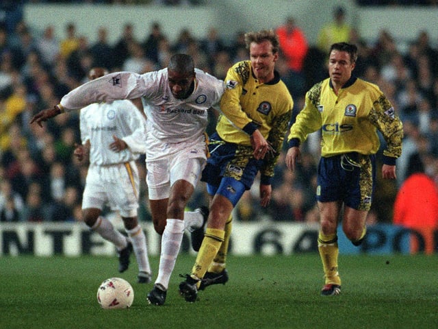 Brian Deane breaks free from Blackburn Rovers defenders Henning Berg (left) and Greame Le Saux during the Premiership clash at Elland Road in April 1997.