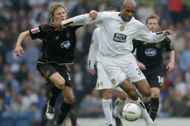 Brian Deane holds off Wigan Athletic's Matt Jackson during the Championship clash at Elland Road in October 2004.