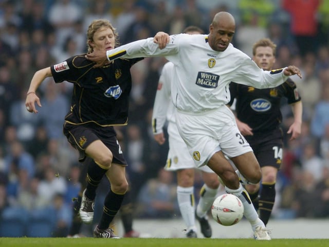 Brian Deane holds off Wigan Athletic's Matt Jackson during the Championship clash at Elland Road in October 2004.
