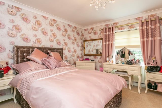 Upstairs are five double bedrooms including a master with an en suite and dressing room area.