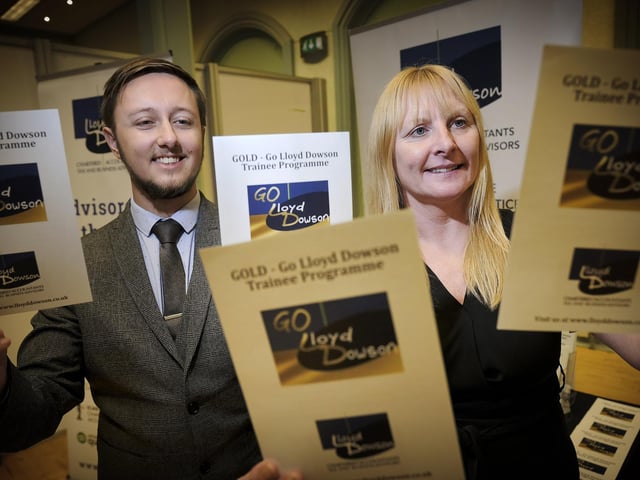 Lloyd Dowson stand with staff Callum Irvine and Vanessa Rowbottom.