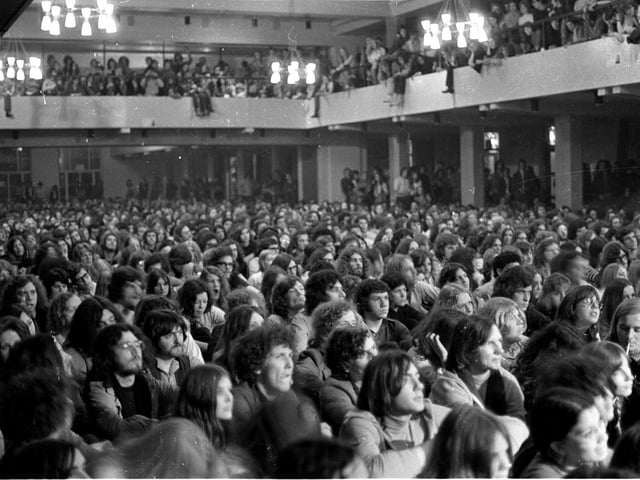 Rolling Stones fans wait for the band to perform at Leeds University.