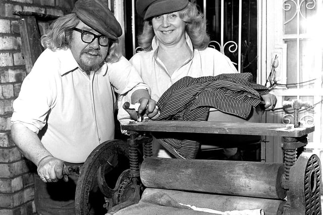 RETRO 1978 Wigan artist James Lawrence Isherwood and his partner Pat White, pictured with an old washing mangle. Isherwood had the idea to transform his home on Wigan Lane into a Lancashire art gallery and  museum, it never happened and the couple parted. He died in 1989