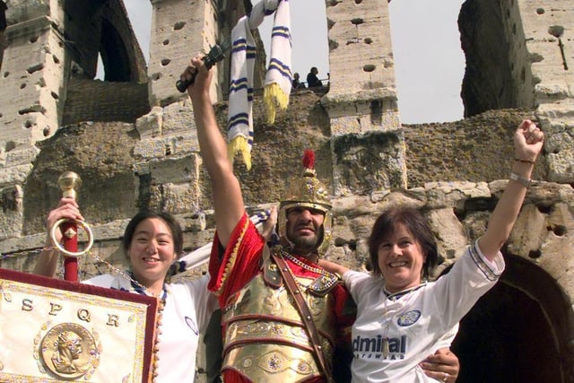 Leeds United fans enjoying themselves at Rome's Colosseum. Pictured is Lai-Yim-Lam, Sarah Dobbs and Chrissie Coleman with Roman soldier.