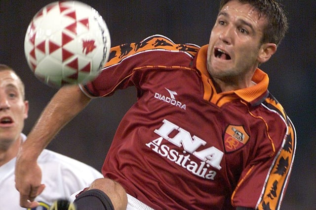 AS Roma's French defender Vincent Candela is challenged by Lee Bowyer.