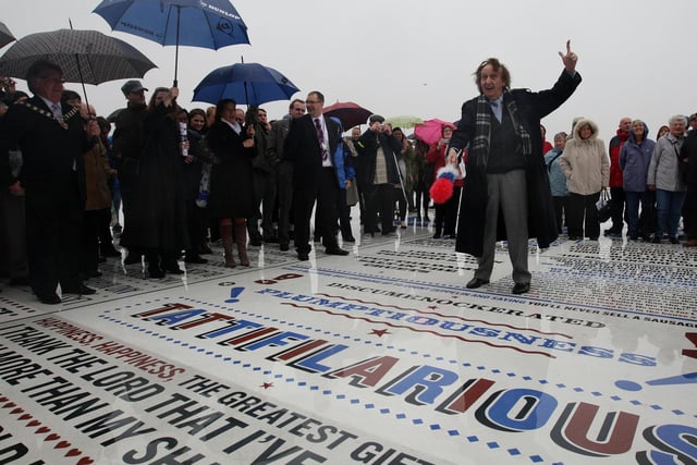Comedian Ken Dodd unveils the Comedy Carpet at the foot of Blackpool Tower. The carpet features comedians’ catchphrases and jokes including one of Dodd’s many catchphrases, ‘Tattifilarious.’  Photo: Dave Thompson/PA Wire