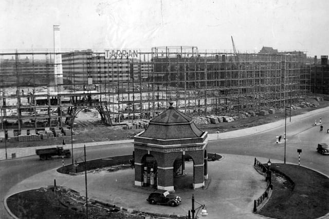 August 1938. Eastgate roundabout with Appleyard petrol filling station.The large archway through to Oastler House is under construction.