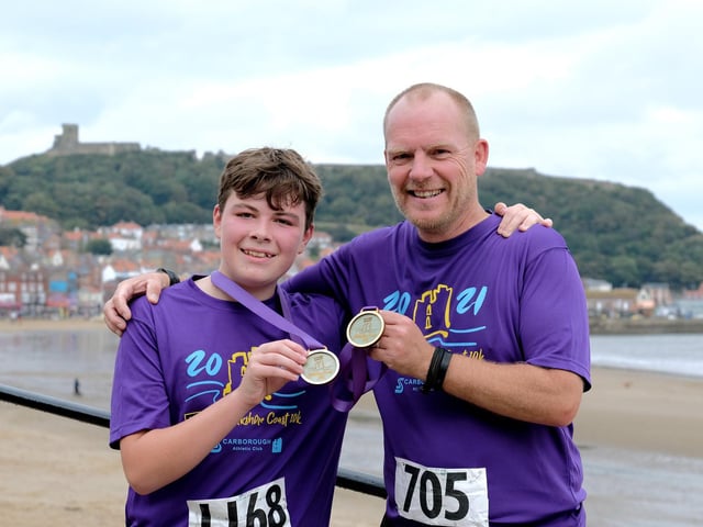 Ben Kirkham and Chris Kirkham-Knowles celebrate finishing the McCain Yorkshire Coast 10k

Photo by Richard Ponter