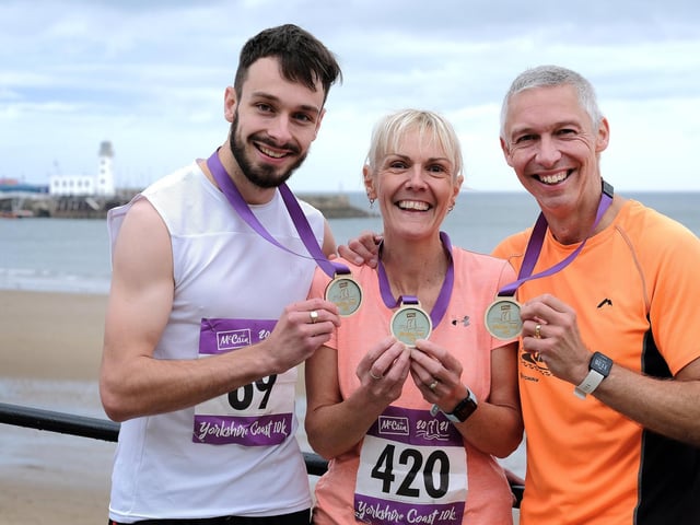 Dan Maw, left, with his mum, Claire Maw, and dad, Rich Maw, after the trio completed the 


Photo by Richard Ponter