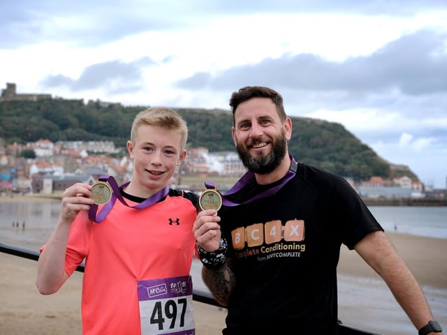 Charlie and Steve Flintoft with their medals after the 10k

Photo by Richard Ponter