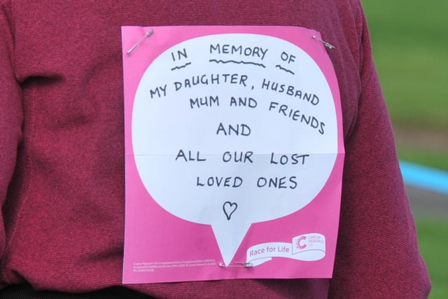 Runners pinned messages of support and tributes to loved ones on their backs for the race.