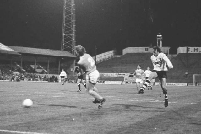 PNE striker John Thomas has a shot at Bloomfield Road in August 1985, behind him you can see Blackpool Tower.
