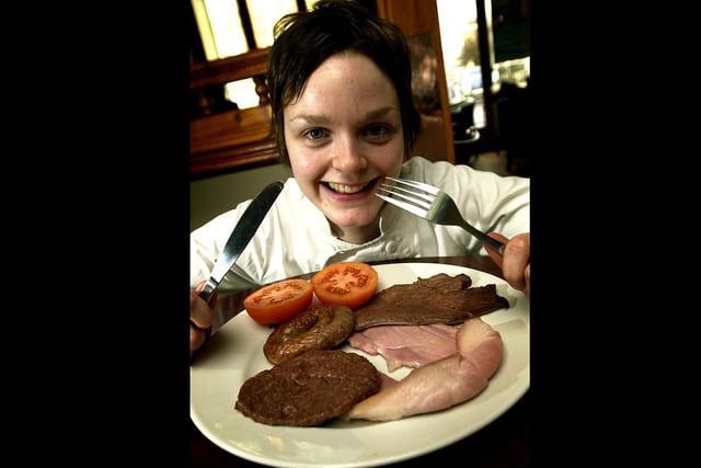 Yates's chef Charlotte Maher prepares to tuck in to a mixed grill at the pub in Preston in aid of the Magic Wand Appeal in 2002