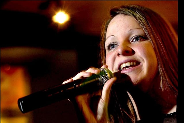 Emma Dane of Ashton, Preston taking part in the regional final of Yates' Karaoke Competition in 2003