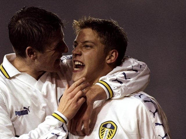 Alan Smith celebrates his goal with fellow strike partner Michael Bridges.