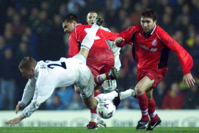 David Batty takes a tumble in the heart of midfield.
