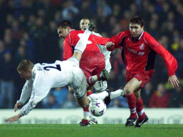 David Batty takes a tumble in the heart of midfield.