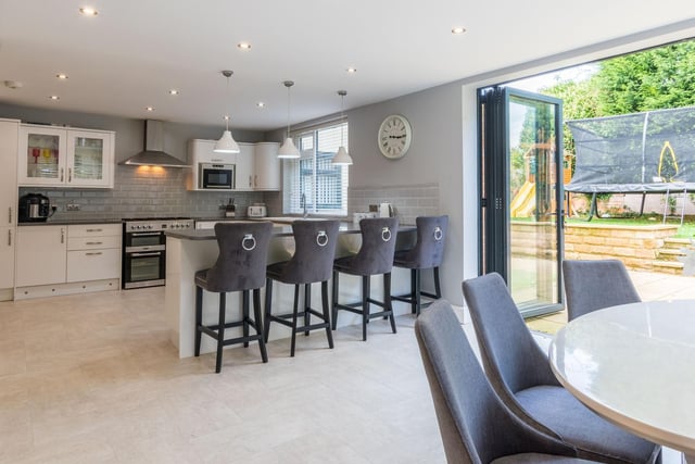 Th open plan kitchen diner features integrated appliances, grey quartz worktops and bi-folding doors out on to the rear terrace and garden areas. Additionally there is a utility room on the ground floor.