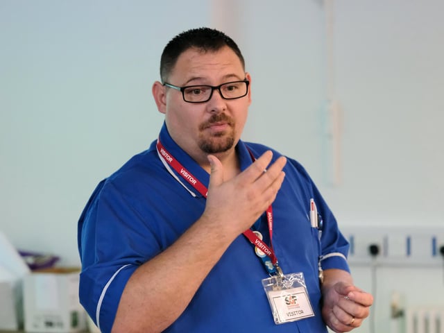Adam Newton addresses the audience.