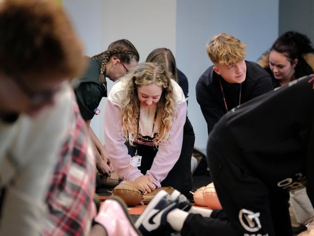 Students have a go at the CPR practical work.