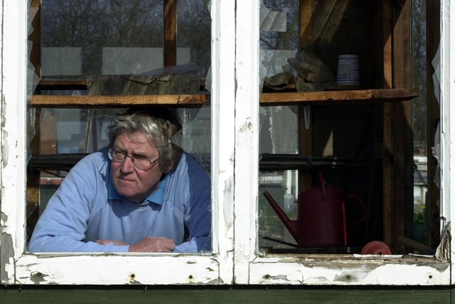 Tony Fitzgerald, chairman of the Clark Fields Allotments in Beeston, surveys the damage caused by vandals in March 2003.