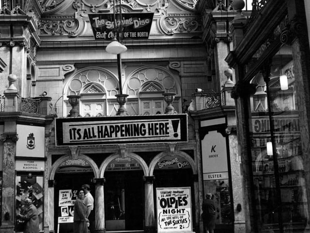 Close up of the entrance to Spinning Disc in County Arcade in 1967 with sign saying 'its all happening here'.