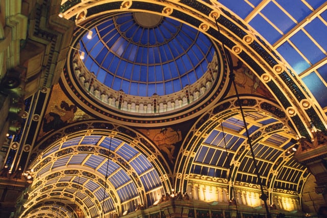 Looking up at the decorative ceiling of the County Arcade, which features a dome in the centre at the point where the County Arcade, which joined by the Cross Arcade. Below the dome are four mosaics which represent Liberty, Commerce, Art and Labour; three of them can be seen here.