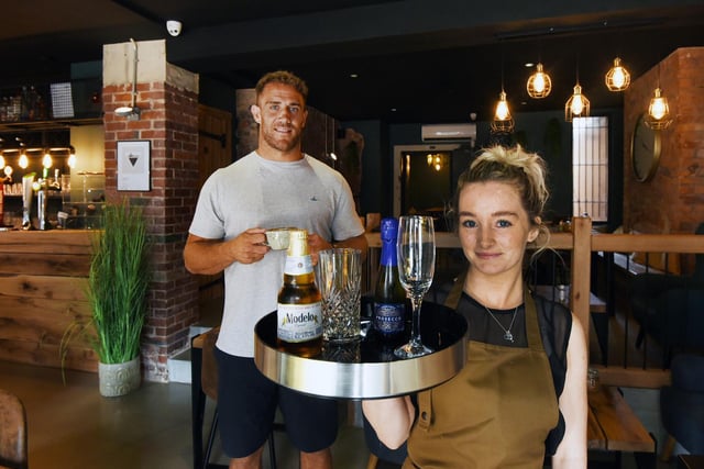 Former Rugby League player Lee Mossop, owner of The Old Bank Coffee and Wine Bar, in former RBS bank,  Ormskirk Road, Pemberton, pictured with Demi Jacques.