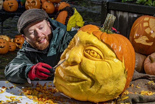 Sand In Your Eye's Jamie Wardley carves the face of eco campaigner Jude Walker into a pumpkin