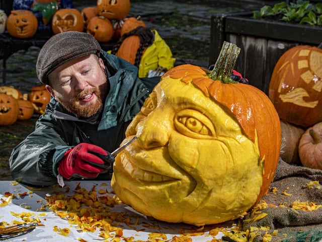 Sand In Your Eye's Jamie Wardley carves the face of eco campaigner Jude Walker into a pumpkin