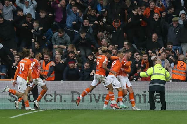Blackpool's fans celebrate Gary Madine's game-winning goal in the derby on Saturday