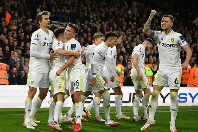 Leeds United's players celebrate the last-gasp equaliser against Wolves at Elland Road. Pic: Getty