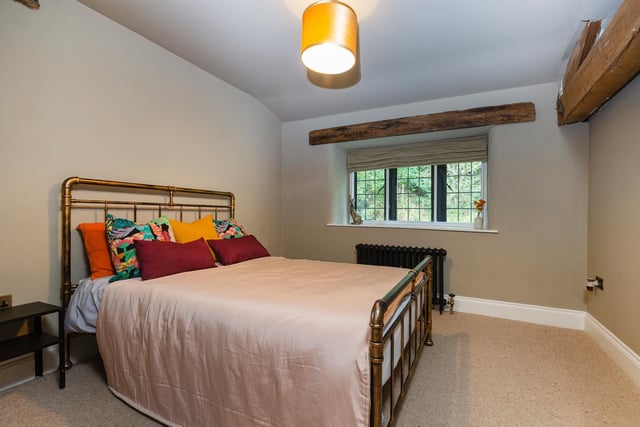 Another house bedroom, with timber beams.