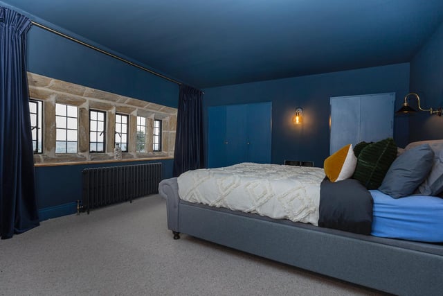 One of the spacious bedrooms within the property.