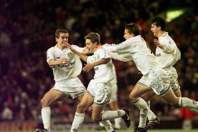 Alan Smith celebrates with fellow academy graduates Harry Kewell and Jonathan Woodgate after scoring on his Leeds United debut. Pic: Gary Longbottom.